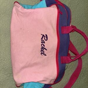 Girl’s overnight bag with large inner pocket and zippered front pocket.